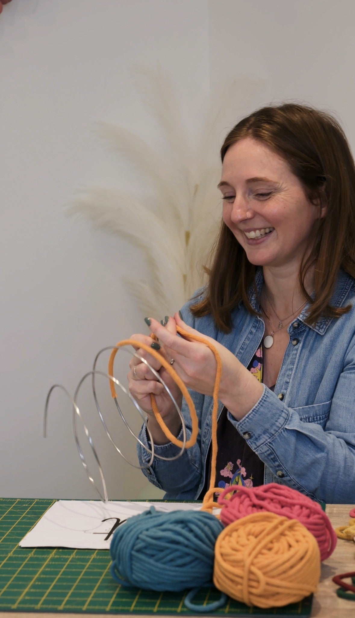 Facilitator working on a creative making project during Make Something Club workshop