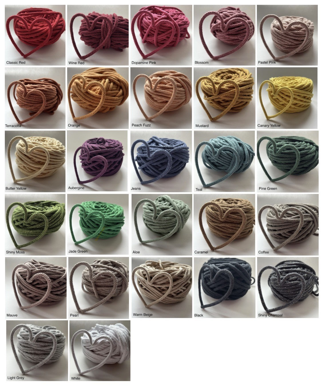 A grid of 30 heart-shaped yarn balls in various colors, arranged in five rows. Each yarn ball is labeled with its color name underneath, including Red, Pink, Brown, Beige, Yellow, Green, Purple, Blue, Gray, and White.