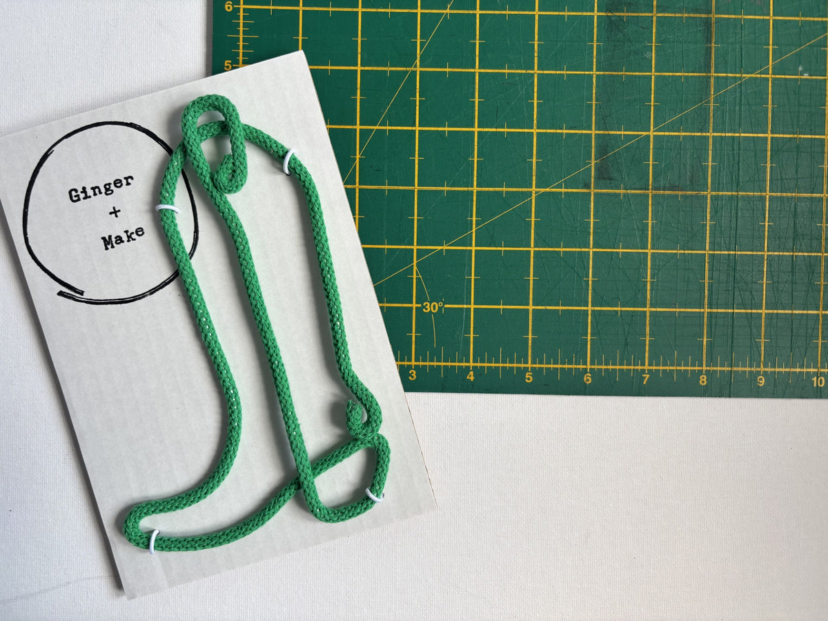 Green cowboy boot made with wire and cotton cord